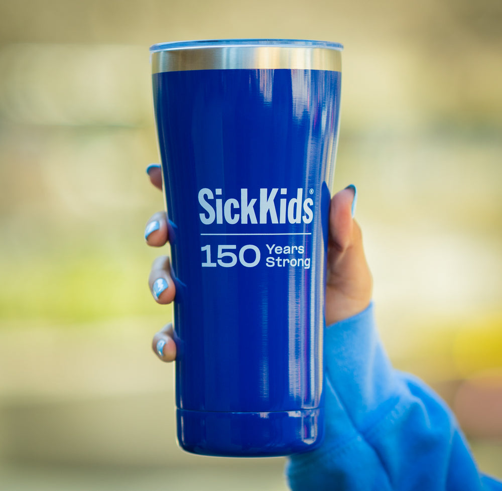 A hand holding a blue stainless steel travel mug with 'SickKids 150 Years Strong' printed on the side.