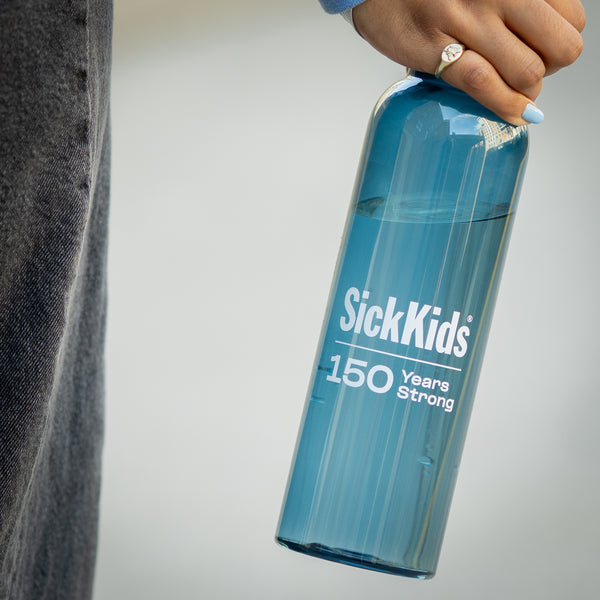 A blue water bottle with a SickKids 150 years strong logo, held by a hand.